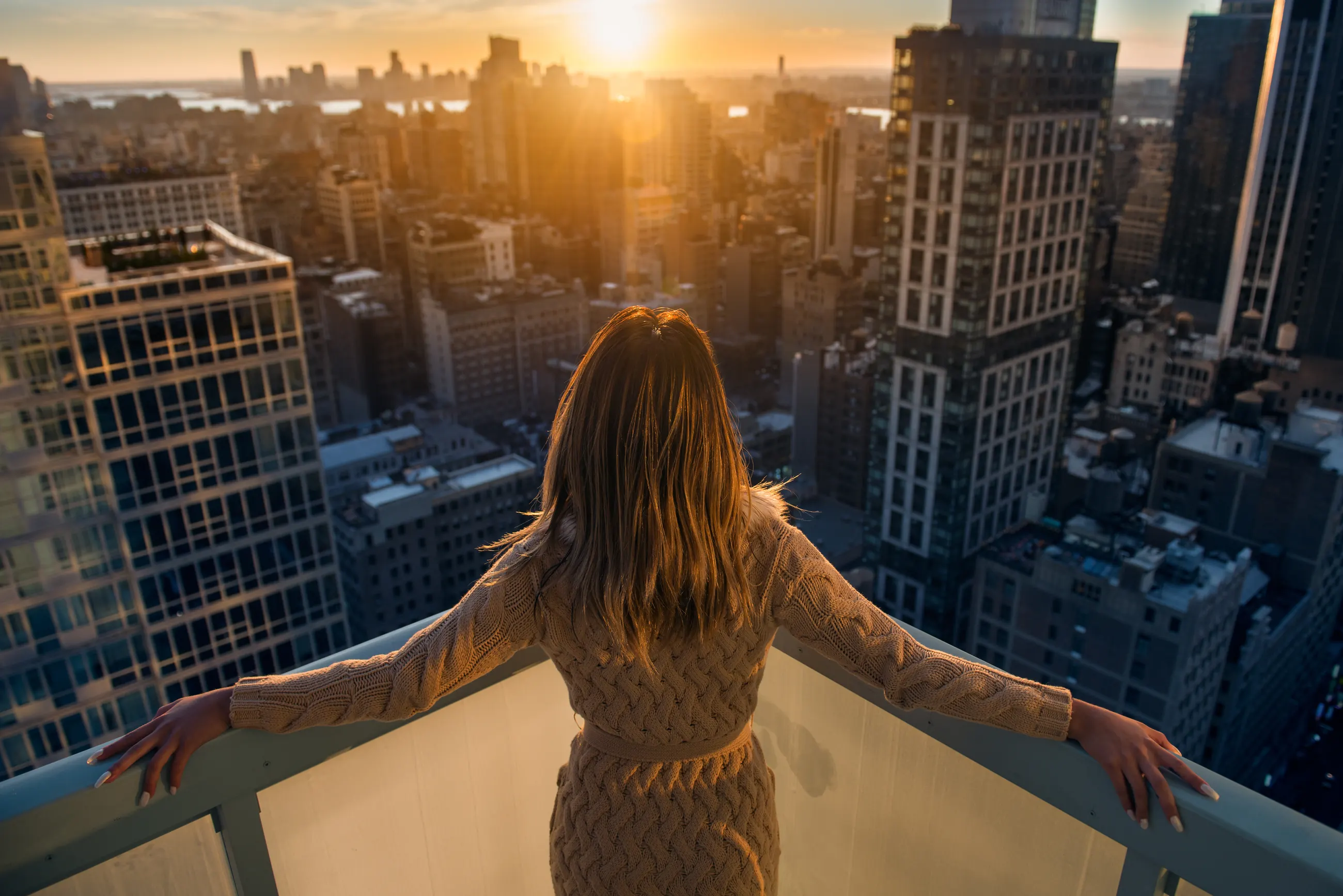 Owner overlooking the city at sunrise
